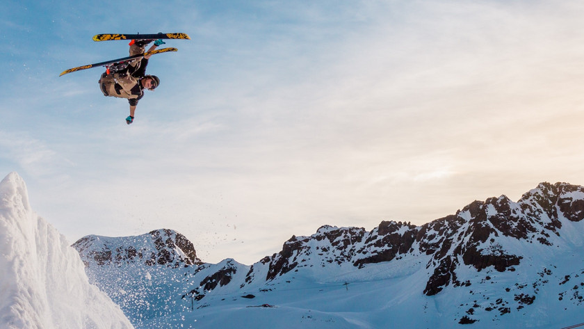 Skiers in a ski area in the mountains.