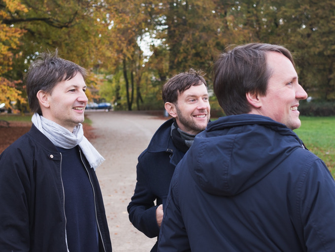 Moccus managing directors are standing in the park in autumn